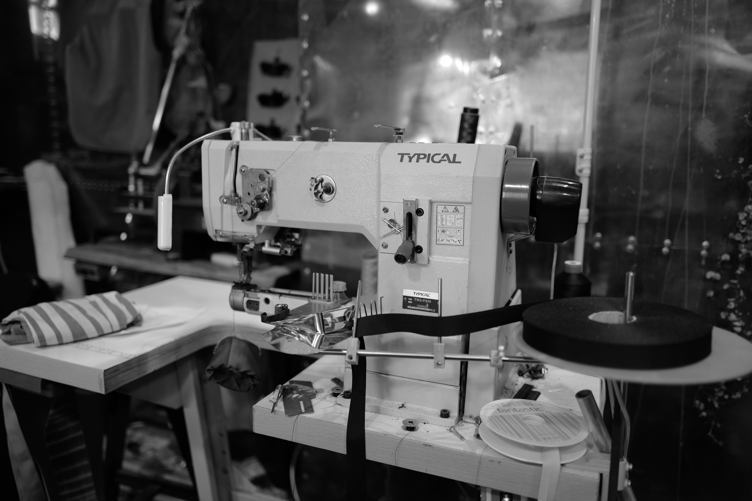A Grayscale Photo of a Sewing Machine